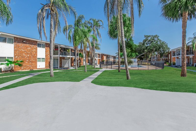 Shaded courtyard walkway between the buildings