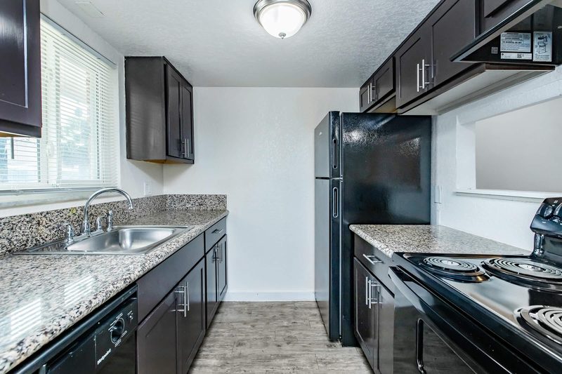 Kitchen with granite countertops and full appliance package