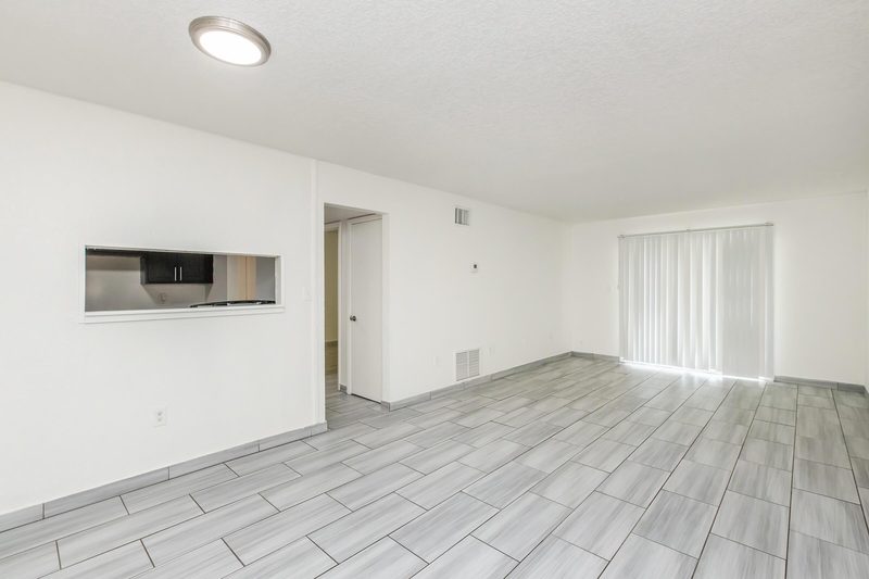Bright living and dining area with wood-style flooring