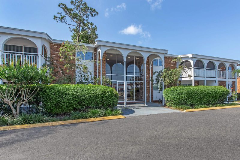 Leasing office entrance with arched breezeway