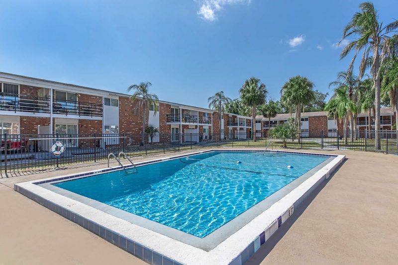 Sparkling swimming pool beside the apartment buildings